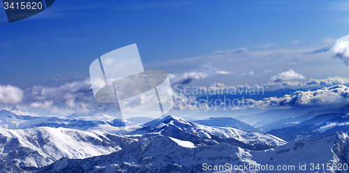 Image of Panoramic view on sunlight snowy mountains