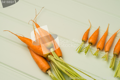Image of Carrots on wooden table