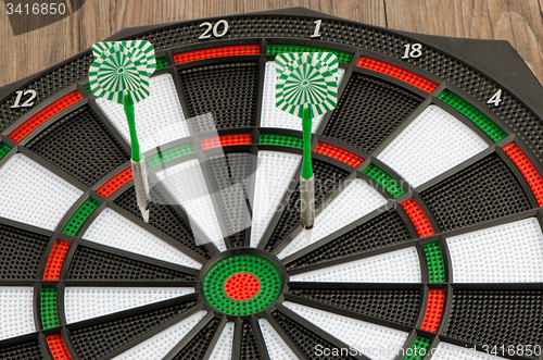 Image of Dart board with darts