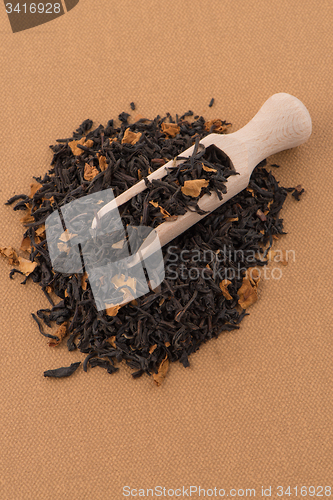 Image of Black Dry Tea with a Wooden Spoon