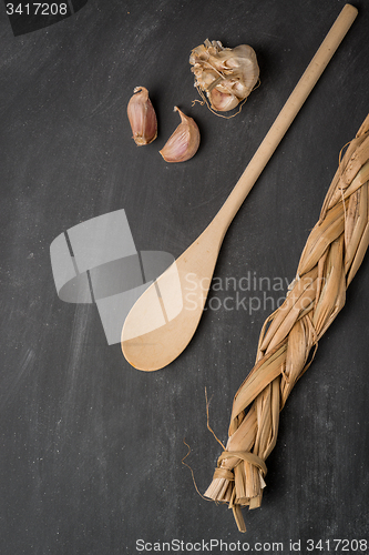 Image of Wooden spoon and garlic 