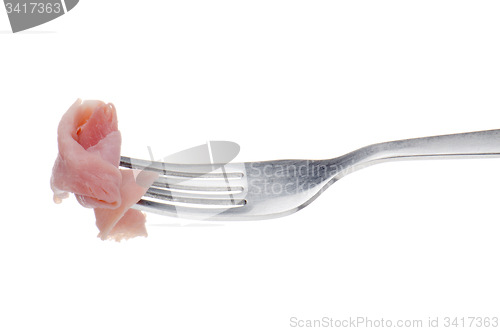 Image of Slice of ham skewered on a fork 