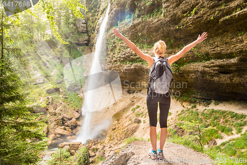 Image of Active sporty woman relaxing in beautiful nature.