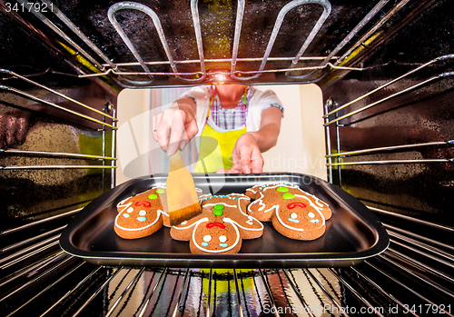 Image of Baking Gingerbread man in the oven