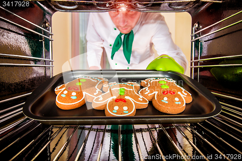 Image of Baking Gingerbread man in the oven
