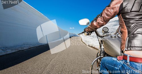 Image of Biker girl First-person view, mountain serpentine.