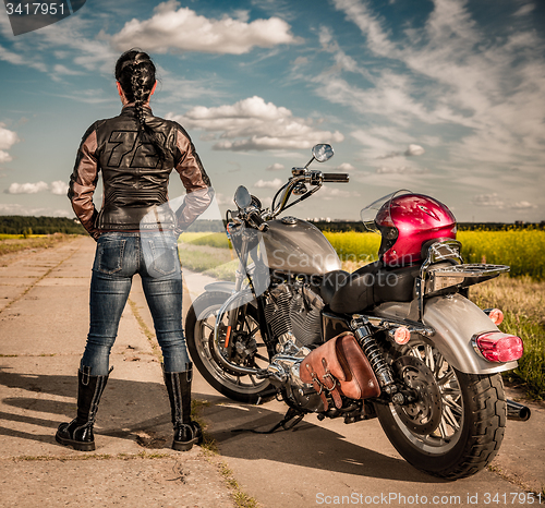 Image of Biker girl on a motorcycle