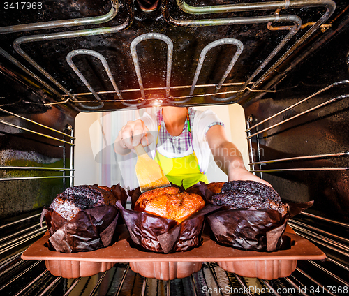 Image of Baking muffins in the oven