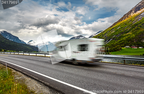 Image of Caravan car travels on the highway.