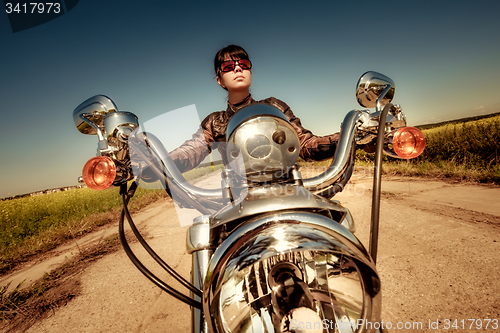 Image of Biker girl on a motorcycle