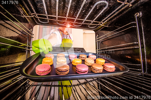 Image of Baking macarons in the oven.