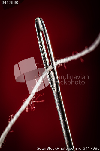 Image of Needle with thread