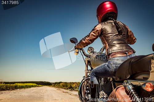 Image of Biker girl on a motorcycle