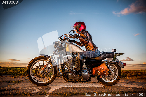 Image of Biker girl on a motorcycle