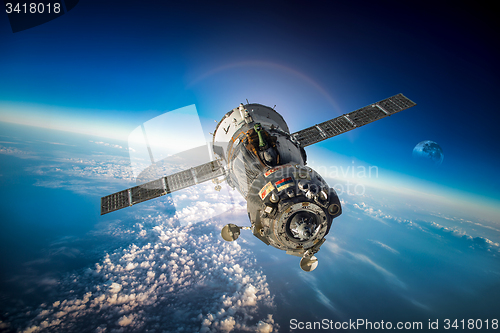 Image of Spacecraft Soyuz over the planet earth