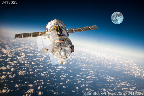 Image of Spacecraft Soyuz over the planet earth