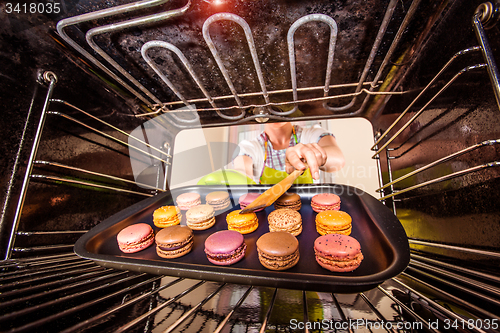 Image of Baking macarons in the oven.