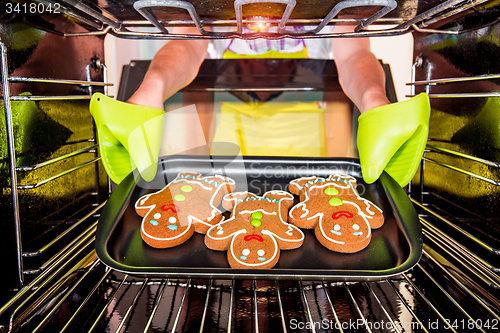 Image of Baking Gingerbread man in the oven