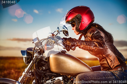 Image of Biker girl on a motorcycle