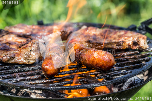 Image of Grilling sausages