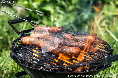 Image of Grilling sausages