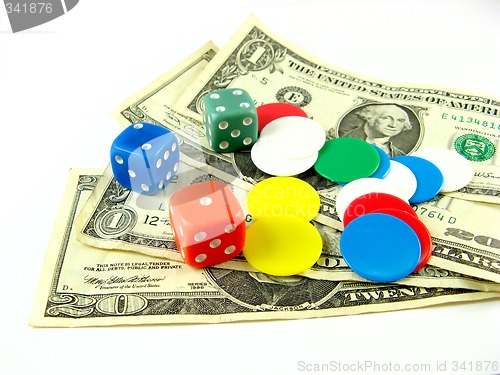 Image of dices,tokens and dollars