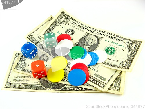 Image of dices,tokens and dollars