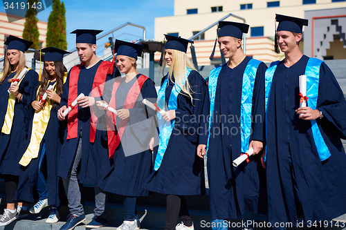 Image of young graduates students group