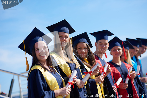 Image of young graduates students group