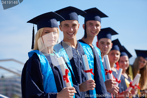 Image of young graduates students group