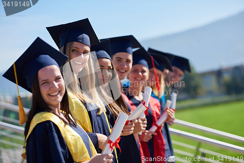 Image of young graduates students group