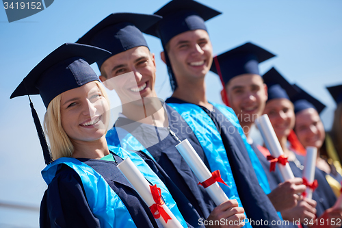 Image of young graduates students group