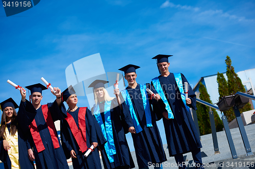 Image of young graduates students group