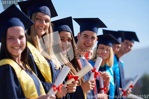 Image of young graduates students group