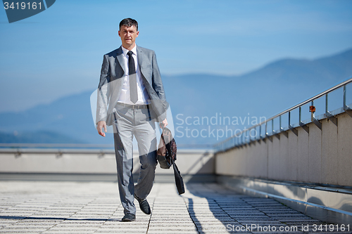 Image of senior  businessman outdoors
