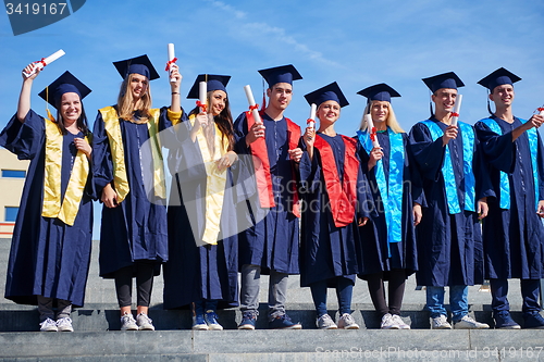 Image of young graduates students group
