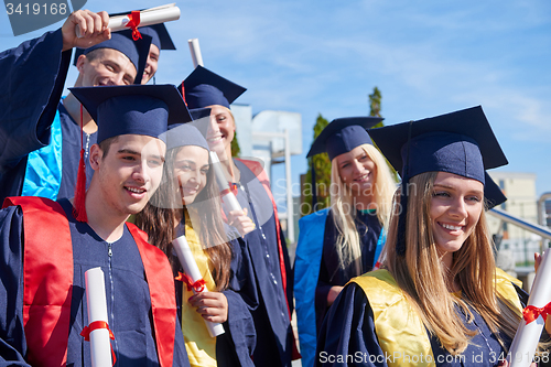 Image of young graduates students group