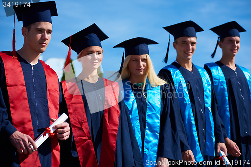 Image of young graduates students group