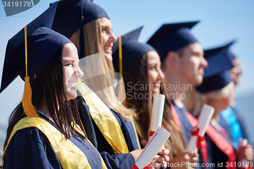 Image of young graduates students group