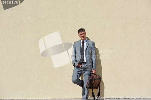 Image of senior  businessman outdoors