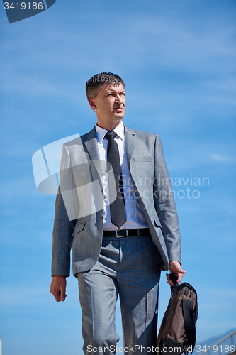 Image of senior  businessman outdoors