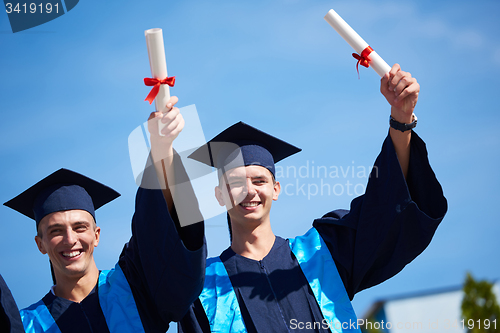 Image of young graduates students group