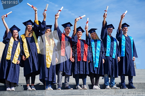 Image of young graduates students group