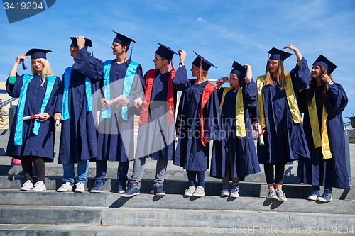 Image of young graduates students group