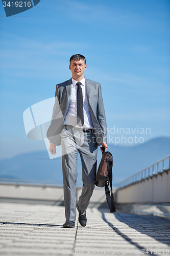 Image of senior  businessman outdoors