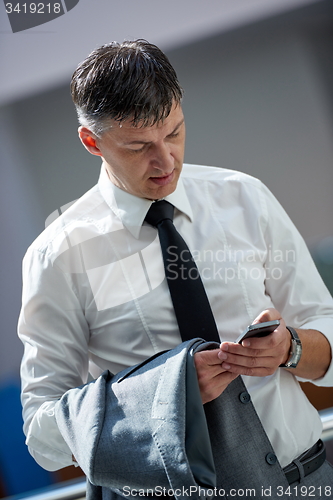 Image of business man using phone