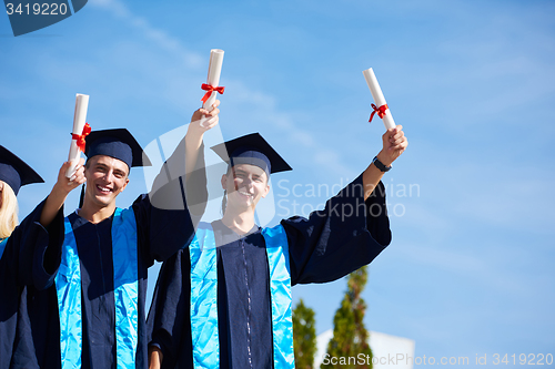 Image of young graduates students group