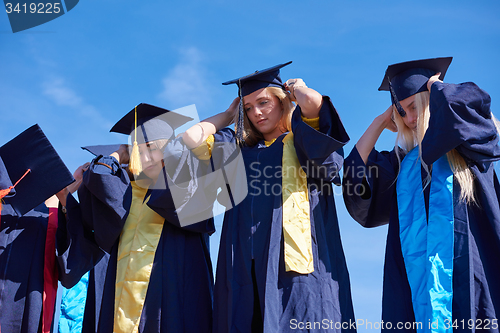 Image of young graduates students group