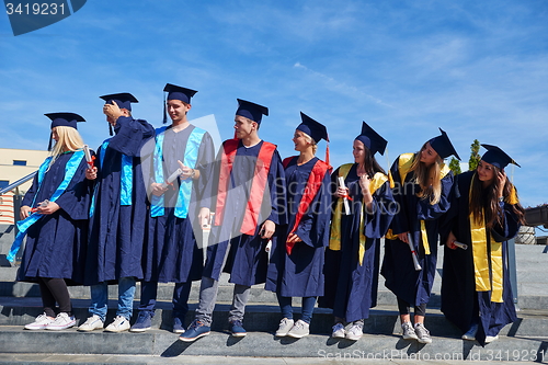 Image of young graduates students group