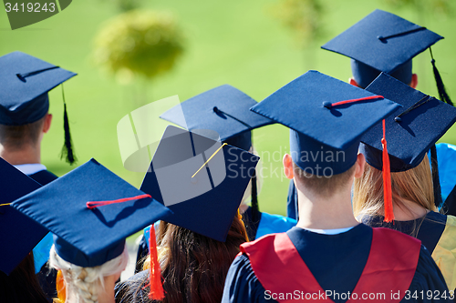 Image of young graduates students group